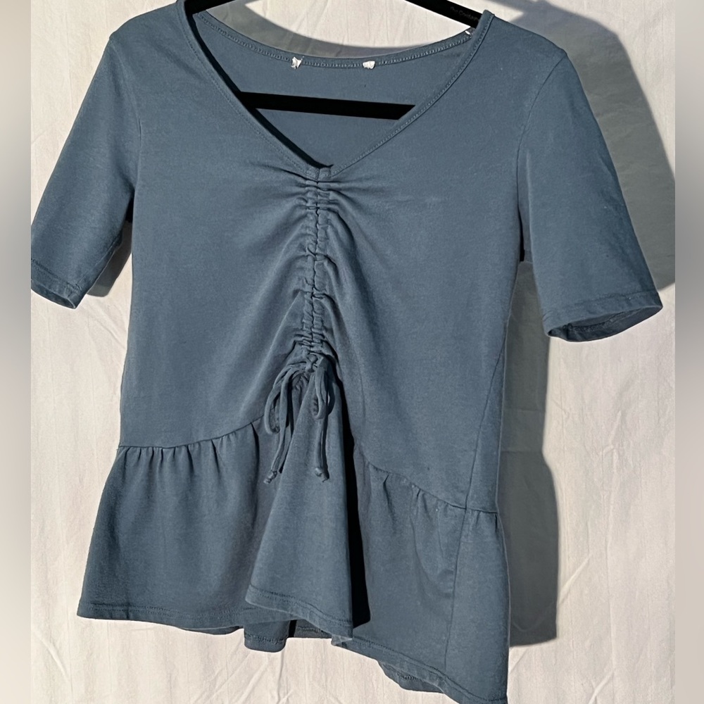 Women’s size small.  Blue/green/gray in color.  Peplum style with drawstring